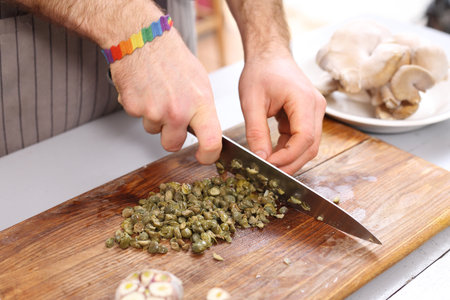 Capers. Cook knife cut capers.の写真素材