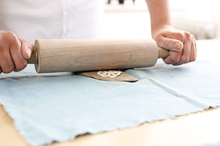 Handicraft. Female hands clay from clay.の写真素材