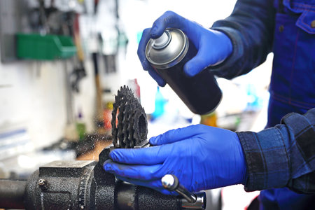 Bike service. Prepare your bike for the cycling season.The mechanic in the bike service lubricates...