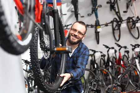 Bike shop. Bicycle seller in a bicycle lounge.の写真素材