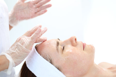 Skin care of the neck and cleavage. Massage in the beauty salonの写真素材
