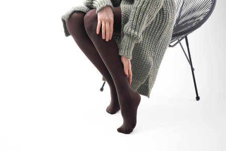 Brown tights. shapely legs of a woman in opaque tights.の写真素材