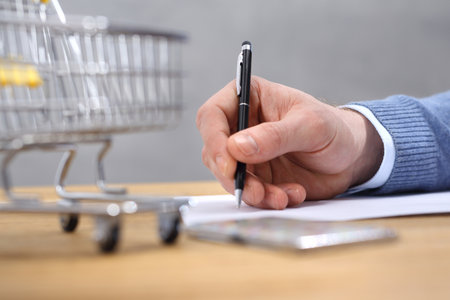 Signing documents. The man signs the documentsの写真素材