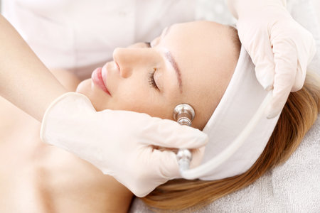 Oxygen therapy. A woman in a beauty salon during a care treatment using active oxygenの写真素材