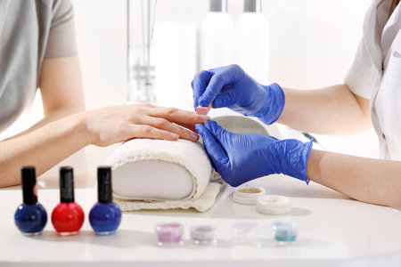 Japanese manicure. The beautician rubs the paste in your nails.の写真素材