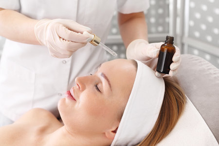 Spa salon. A woman during a face treatment.の写真素材