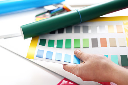 Color sampler. The designer chooses the color of the foilの写真素材