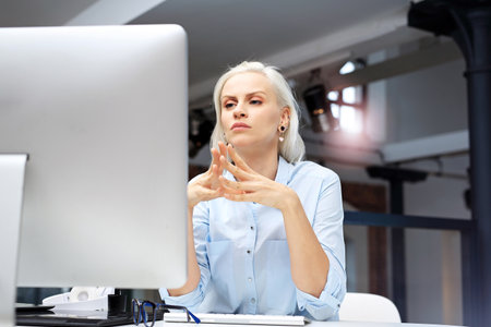 Office work. The woman is working at the computer.の写真素材