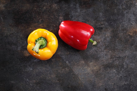 Pepper. A composition of red and yellow peppers on a black background.