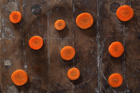 Carrot. Carrot rings on a wooden table
