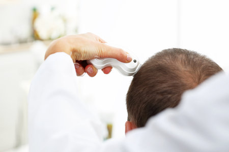 Hair analysis. Trichological examination. The head of a hair with the microscopeの写真素材