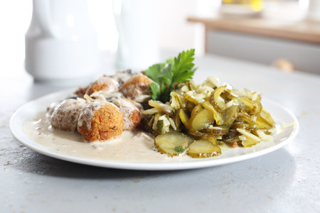 Meatballs. Meatballs in a cream sauce with buckwheat and a cucumber salad.の写真素材