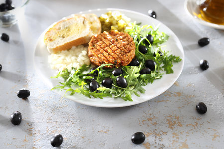Vegetable snack served with olives and cucumber.の写真素材