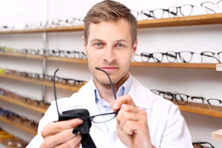 Optician cleans glasses.の写真素材