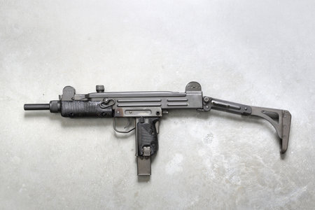 Machine gun. Rifle on a gray background.の写真素材