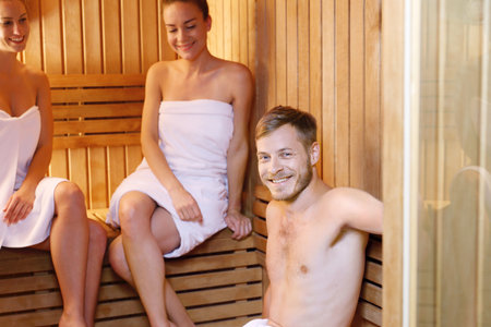 Relax in the sauna. A group of friends in the sauna.の写真素材