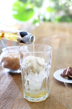 Coffee with syrup. Preparation of coffee with milk, flavored syrup, ice cream and whipped cream.の写真素材