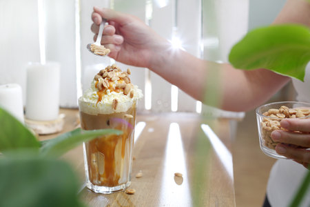 Coffee with salty caramel and nuts.の写真素材