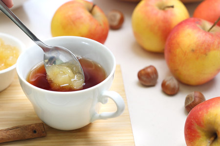 Warming tea with apple jamの写真素材
