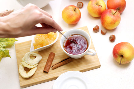 Winter tea with apples and cinnamonの写真素材