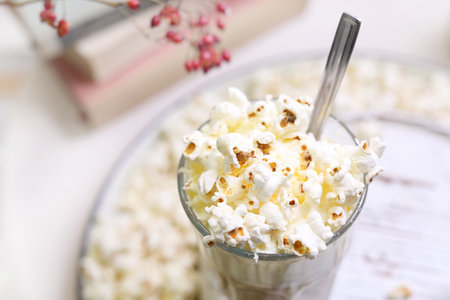 Coffee with popcorn. A glass of coffee with milk and cream with the addition of popcorn.の写真素材