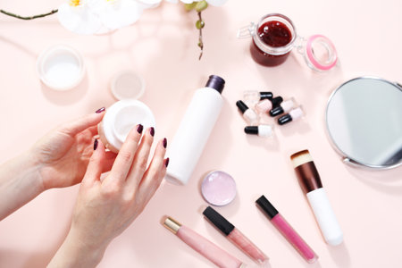 Hand cream. The woman is getting a cream on her hands.の写真素材