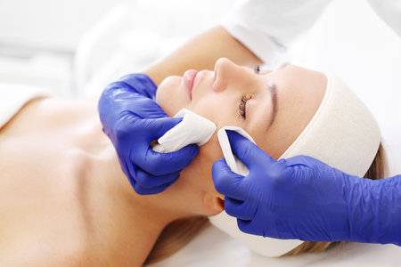 Cleansing facial skin, beautician squeezed blackheads.の写真素材