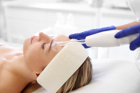 Oxygen biofusion. A woman in a beauty salon during a care treatment using oxygenの写真素材
