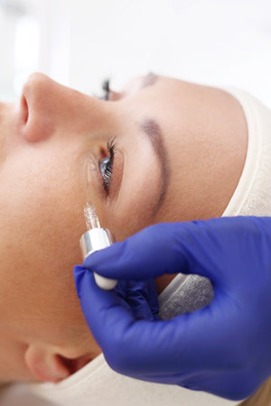 Wrinkles around the eyes. Beauty imposes on the woman's face cosmetic preparationの写真素材