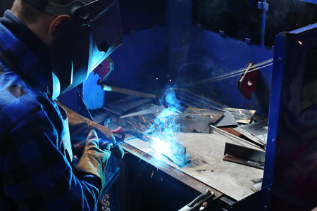 Welding. The man is welding in the workshop.の写真素材