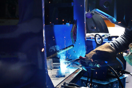 Welding. The man is welding in the workshop.の写真素材