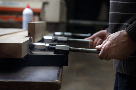 Carpenter's workshop. Gluing boards.の写真素材