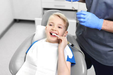 Treatment of tooth loss, child at the dentistの写真素材