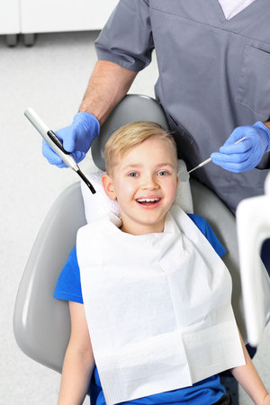 Dentistry, a joyful child in a dental chairの写真素材