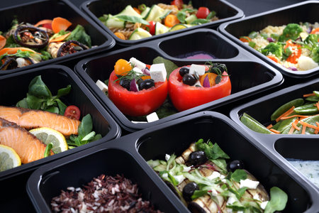 Healthy food and diet concept, restaurant dish delivery. Take away of fitness meal. Weight loss nutrition in foil boxes.の写真素材