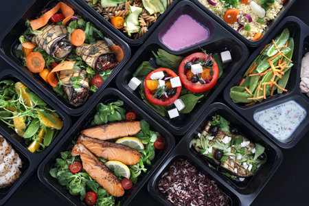 Healthy food and diet concept, restaurant dish delivery. Take away of fitness meal. Weight loss nutrition in foil boxes.の写真素材