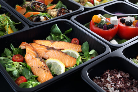 Healthy food and diet concept, restaurant dish delivery. Take away of fitness meal. Weight loss nutrition in foil boxes.の写真素材