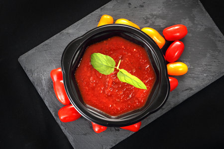 Tomato cream, dinner dish in a plastic bowlの写真素材