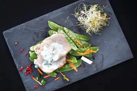 Dinner meal in a box diet. Chicken in herbs with yogurt sauce with green saladの写真素材
