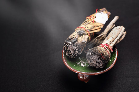 Incense with white sage and cedar herbs.の写真素材