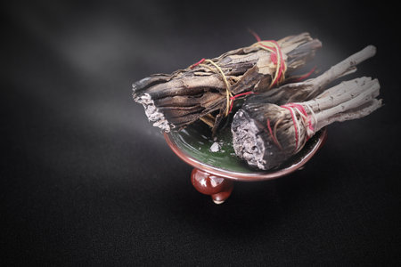 Incense with white sage and cedar herbs.の写真素材