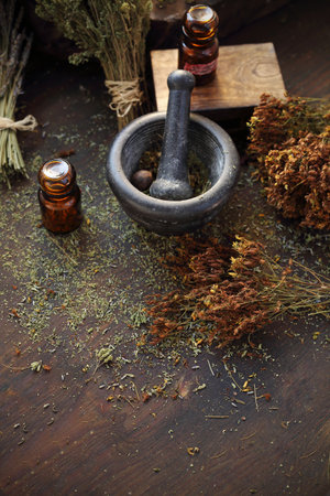 Herbology and herbal medicine, preparing a herbal mixture in a mortarの写真素材
