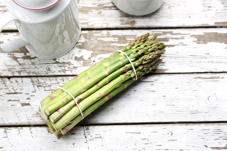 Asparagus. Green asparagus on a wooden background with space for text.の写真素材