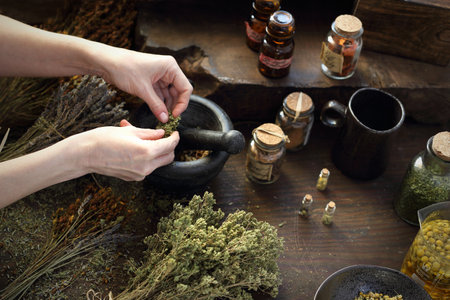 Hands with Herbal oils and natural medicines. Herbal medicine and alternative medicine..の写真素材