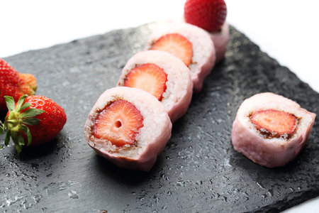 Fruit sushi, a sushi roll with strawberry and chocolate.の写真素材