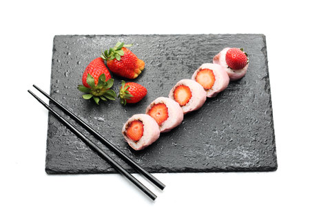 Strawberry sushi. Sushi roll with strawberry and chocolate.の写真素材