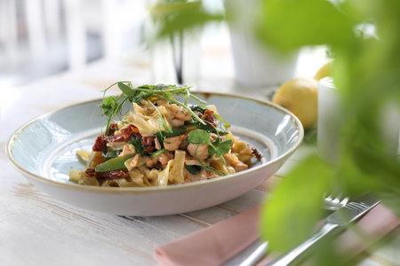Dish served in the restaurant tagliatelle spaghetti with salmon and dried tomatoes. Proposition of serving the dish.の写真素材