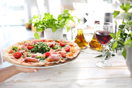 In the restaurant. Woman eating pizzaの写真素材
