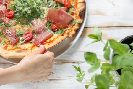 In the restaurant. Woman eating pizzaの写真素材