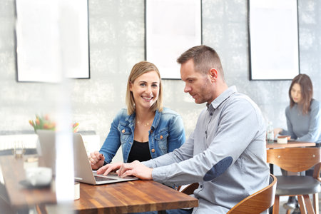 Budget planning. The woman and the man are working together on the computer.の写真素材
